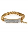 Make a name for yourself with this half-stretch ID bracelet from Kenneth Cole New York. Crafted from gold-tone mixed metal, the ID plate features silver-colored glitter accents for a lustrous effect. Item comes packaged in a signature Kenneth Cole New York Gift Box. Approximate diameter: 2-1/2 inches.