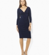 Shirring at one side creates a sleek, flattering silhouette, rendered in smooth matte jersey for a look of smart sophistication on this petite Lauren by Ralph Lauren dress.