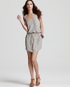 Polka dots add instant chic to this Sam & Lavi dress, finished with a waist-cinching drawstring tie and casual-cool pockets.