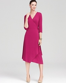 A jewel-tone palette breathes distinctive life into an Eileen Fisher wrap dress, finished with an angled hem for a strikingly modern silhouette.