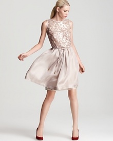 You're in party-perfect fashion in this stunning silver-sequined Escada dress, an airy silhouette for your special evening. Flaunting a deep v back, the luxe look is cinched at the waist with a self-tie belt for a statement finish. You're in party-perfect fashion in this stunning silver-sequined Escada dress, an airy silhouette for your special evening. Flaunting a deep v back, the luxe look is cinched at the waist with a self-tie belt for a statement finish.