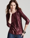 This Calvin Klein sequin top marries high-shine sequins with a classic silhouette for work-to-weekend glamour.