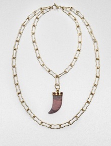 From the Horn Collection. A flat horn-shaped pendant of richly veined natural stone hangs from a double open chain in this dramatic design.Natural stone18k goldplatedLonger chain length, about 18Pendant length, about 2.5Toggle closureMade in USA From the Horn Collection. A flat horn-shaped pendant of richly veined natural stone hangs from a double open chain in this dramatic design.Natural stone18k goldplatedLonger chain length, about 18Pendant length, about 2.5Toggle closureMade in USA