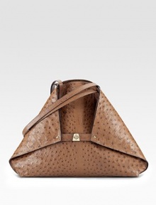 Rich ostrich skin, crafted in a foldover trapezoid silhouette, cinched by a center buckle closure.Shoulder straps, 10½ drop Buckle strap Protective metal feet One inside zip pocket Two inside open pockets Leather lining 20W X 18½H X 5½D Imported Rich ostrich skin, crafted in a foldover trapezoid silhouette, cinched by a center buckle closure.Shoulder straps, 10½ drop Buckle strap Protective metal feet One inside zip pocket Two inside open pockets Leather lining 20W X 18½H X 5½D Imported
