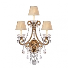 The curved arms, cascading crystals and candle flame-shaped bulbs on this Ralph Lauren sconce will illuminate your decor with unparalleled glamour. The curved arms, cascading crystals and candle flame-shaped bulbs on this Ralph Lauren sconce will illuminate your decor with unparalleled glamour.