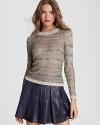 Beading and sequins embellish this luxe statement sweater from Alice + Olivia.