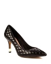 VINCE CAMUTO takes ultra-stylish pointed toe pumps to another fashion level with quilted leather and boldly gold heel accents.