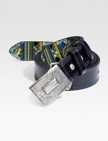 Sleek, full-grained leather finished with printed interior and contrast stitching for an unexpected pop of color.Metal buckleAbout 1½ wideImported