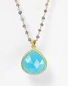 Small gray iolite stones lead to a dazzling, sky-blue faceted chalcedony pendant. By Coralia Leets.