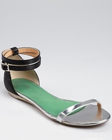 With a futuristic feel, these Tibi sandals lend cutting-edge style. Blending gilded metallic leather and snake embossed details, this fashion-forward footwear is easily dressed up or down.