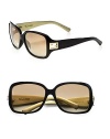 This simply chic design boasts a glossy, plastic frame with metal accented logo end pieces. Available in black/flash gold with brown gradient lens. Logo end pieces100% UV protectionMade in Italy 