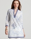 Segue into a softer palette with this Vineyard Vines tunic boasting breezy cotton in a subtle tropical print.