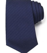 An impeccable herringbone tie made with artisan precision, featuring Turnbull & Asser's unique slip stitch detailing for a lifetime of shape retention. Revivify your wardrobe with a dose of classic luxury.