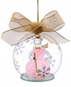 Pretty in pink! A fancy snowgirl with gold broom, scarf and hat sits inside a clear glass orb in this whimsical ornament from Lenox. With gold bow and hanging thread.