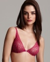 A sheer floral lace underwire bra with unlined cups, plunging neckline and logo detail at center front.