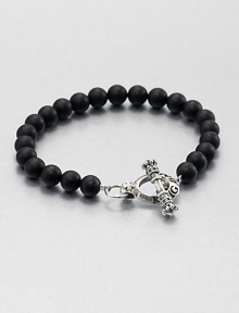 Elegant black onyx beads are joined together by logo-engraved toggle clasp of sterling silver.Sterling silverBlack onyxDiameter, about 3Width, about 8mmToggle claspMade in USA Elegant black onyx beads are joined together by logo-engraved toggle clasp of sterling silver.Sterling silverBlack onyxDiameter, about 3Width, about 8mmToggle claspMade in USA