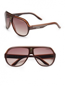 Sporty plastic shield frames with signature stripe logo detail. Available in black crystal orange with grey gradient lens, brown crystal yellow with brown grey gradient lens or brown white with brown gradient lens. Injected propionate lens 100% UV protection Imported Sporty plastic shield frames with signature stripe logo detail. Available in black crystal orange with grey gradient lens, brown crystal yellow with brown grey gradient lens or brown white with brown gradient lens. Injected propionate lens 100% UV protection Imported