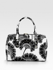 Blooming flowers cover this sturdy nylon top handle carryall, complete with a signature logo plaque. Double top handles, 5½ dropTop zip closureProtective metal feetOne inside zip pocketTwo inside open pocketsFully lined12W X 7½H X 5½DImported Blooming flowers cover this sturdy nylon top handle carryall, complete with a signature logo plaque. Double top handles, 5½ dropTop zip closureProtective metal feetOne inside zip pocketTwo inside open pocketsFully lined12W X 7½H X 5½DImported