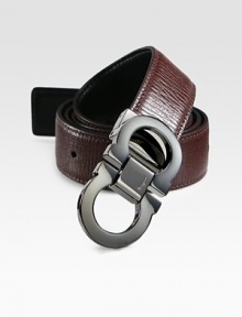 Smooth on one side and textured on the other, this reversible belt crafted in smooth Italian leather with double gancini buckle, will be a versatile addition to your existing wardrobe.LeatherAbout 1½ wideMade in Italy Smooth on one side and textured on the other, this reversible belt crafted in smooth Italian leather with double gancini buckle, will be a versatile addition to your existing wardrobe.LeatherAbout 1½ wideMade in Italy