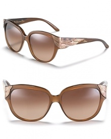 Stone-embellished wing details on the arms lend retro-cool flair to these square cat-eye sunglasses from Dior.