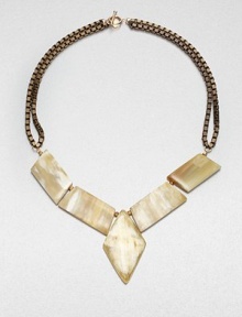 A geometric design featuring recycled cow horn on antique-finished box chains. Recycled Ankole cow hornBrassLength, about 21Lobster clasp closureMade in USA A geometric design featuring recycled cow horn on antique-finished box chains. Recycled Ankole cow hornBrassLength, about 21Lobster clasp closureMade in USA