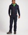 A go-anywhere layer with a zip-up front and an adjustable hood for a perfect fit.Hooded style with drawstring bungee cordZip-front closureSplit kangaroo pocket with double snap closuresLong sleeves with ribbed cuffsSingle zip pocket at armRibbed hem84% cotton/16% polyesterMachine washImported