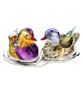 A striking pair, the Topaz Mandarin duck figurines nest together in a bed of silvertone metal. Exquisite faceted detail and vibrant colors in Swarovski crystal capture the natural beautiful of the real birds.