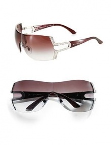 A unique 146 Swarovski crystal Parentesi embellishment inspired by the joints of Roman pavement adds a glamorous touch to these contemporary metal shield frames. Available in silver/violet with violet gradient lens. UV 400 lens 100% UV protection Made in Italy A unique 146 Swarovski crystal Parentesi embellishment inspired by the joints of Roman pavement adds a glamorous touch to these contemporary metal shield frames. Available in silver/violet with violet gradient lens. UV 400 lens 100% UV protection Made in Italy