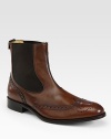 EXCLUSIVELY OURS. Modern style marries classic detailing with our Chelsea boot, finished with wingtip perforations and mesh insets for a better fit. Side mesh insetsLeather liningLeather soleMade in Italy