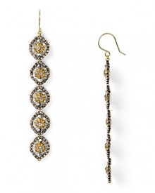 Miguel Ases' gold-flecked earrings are a glamourous take on beads. Equal parts delicate and dramatic, these linear drops beg for a bold lip and slinky gown.