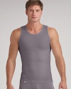 An essential underlayer or workout separate with an exclusive design that builds in physiotherapy taping techniques to gently pull the shoulders back and promote optimal alignment. Seamless stitching and targeted mesh provides a breathable, second skin fit. Micro polyester/nylon/spandex; machine wash Imported