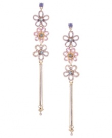 Sweet shoulder dusters. Betsey Johnson romanticizes the latest trend with the addition of three shimmering flower charms. Crafted in antique gold-plated mixed metal with pink, purple, and blue crystal accents. Approximate drop: 5-1/2 inches.