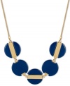 Feeling blue? Let this striking necklace cheer you up! Blue beaded circles create a unique effect on Kenneth Cole New York's frontal design. Set in gold tone mixed metal. Approximate length: 17 inches + 3-inch extender. Approximate drop: 1 inch.