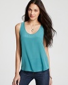 This timeless tank is a must-have this season, rendered in luxurious silk with a deep scoop neck and rounded hem.