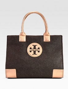 Warm and tactile felt accented in contrasting, metallic leather trim.Double leather top handles, 7½ dropMagnetic snap closureOne inside zip pocketTwo inside open pocketsCotton lining17W X 13H X 5¾DImported Warm and tactile felt accented in contrasting, metallic leather trim.Double leather top handles, 7½ dropMagnetic snap closureOne inside zip pocketTwo inside open pocketsCotton lining17W X 13H X 5¾DImported