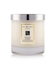 A youthful and fruity fragrance, inspired by the delicious scent of just-ripening nectarines and a taste of refreshing peach sorbet. Mouthwatering nectarine and peach with hints of plum, blackcurrant and vetiver are combined with the sweet warmth of acacia honey in this truly seductive combination. The Nectarine Blossom & Honey Home Candle infuses any room with evocative scent and lasts for hours. An everyday luxury, it brings warmth to any environment. 200g. A youthful and fruity fragrance, inspired by the delicious scent of just-ripening nectarines and a taste of refreshing peach sorbet. Mouthwatering nectarine and peach with hints of plum, blackcurrant and vetiver are combined with the sweet warmth of acacia honey in this truly seductive combination. The Nectarine Blossom & Honey Home Candle infuses any room with evocative scent and lasts for hours. An everyday luxury, it brings warmth to any environment. 200g.