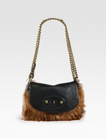 Indulge in this petite fox fur and leather style that is crafted to perfection.Detachable convertible chain shoulder strap, 11-20 dropTurnlock flap closure8W X 6H X 1½DImported Indulge in this petite fox fur and leather style that is crafted to perfection.Detachable convertible chain shoulder strap, 11-20 dropTurnlock flap closure8W X 6H X 1½DImported