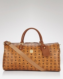 Take a holiday from drab luggage with MCM's heritage-inspired weekender bag, featuring double handles and an adjustable shoulder strap. By MCM. Take a holiday from drab luggage with MCM's heritage-inspired weekender bag, featuring double handles and an adjustable shoulder strap. By MCM.