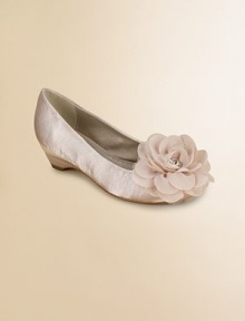 A graceful ballerina style on a tiny heel with a sweet rosette of layered tulle at the toe.Faux leather polyurethane upperTulle rosette with rhinestone centerCovered heel with rubber soleSelf liningPadded insoleImported A graceful ballerina style on a tiny heel with a sweet rosette of layered tulle at the toe.Faux leather polyurethane upperTulle rosette with rhinestone centerCovered heel with rubber soleSelf liningPadded insoleImported