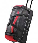 Stay on the move. This rolling duffel is crafted from a highly durable polyester and protected by end bumpers and bottom runners for a long-lasting presence that maneuvers trip after trip with incredible ease. The perfect size for last-minute getaways, this drop-bottom duffel features an easy-access exterior zip pocket and a spacious ready-to-pack interior.