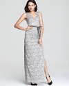 In shimmering, metallic lace, BCBGMAXAZRIA's long dress shows off a modern fabric with classic, ladylike appeal. A grosgrain ribbon belt ensures a flattering fit.