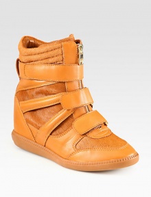 Lush calf hair adds the perfect amount of impact to this urban-inspired leather silhouette, with a hidden wedge and wide velcro straps. Hidden wedge, 3¾ (95mm)Rubber platform, ½ (15mm)Compares to a 3¼ heel (80mm)Leather and calf hair upperZip front with velcro strapsLeather liningRubber solePadded insoleImported Lush calf hair adds the perfect amount of impact to this urban-inspired leather silhouette, with a hidden wedge and wide velcro straps. Hidden wedge, 3¾ (95mm)Rubber platform, ½ (15mm)Compares to a 3¼ heel (80mm)Leather and calf hair upperZip front with velcro strapsLeather liningRubber solePadded insoleImported
