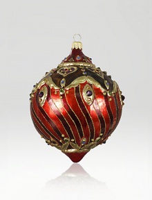 The Heritage of Jay Strongwater began as the bejeweled frame with beautiful stone settings and scrolls, becoming the source of inspiration for this season's new glass ornament collection. This ornament is mouth blown and decorated in Poland with a wonderful team of old world craftsmen. Detailed with crystals, hand applied jewel tone colors and scrolls as if it were a fine piece of jewelry.GlassCrystalMouth blownHand-painted and hand-set5.5H X 3.75W X 4DImported The Heritage of Jay Strongwater began as the bejeweled frame with beautiful stone settings and scrolls, becoming the source of inspiration for this season's new glass ornament collection. This ornament is mouth blown and decorated in Poland with a wonderful team of old world craftsmen. Detailed with crystals, hand applied jewel tone colors and scrolls as if it were a fine piece of jewelry.GlassCrystalMouth blownHand-painted and hand-set5.5H X 3.75W X 4DImported