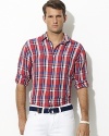 Tailored in a sleek, light-as-air linen-silk blend, a trim-fitting sport shirt exudes breezy resort style with a vibrant, colorful madras print.