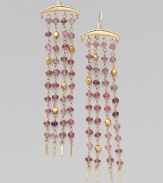 A four-strand fringe design dangles tiny beads of pink tourmaline and 18k gold from a polished 14k gold bar.Pink tourmaline 14k and 18k yellow gold Length, about 3 Ear wire Imported