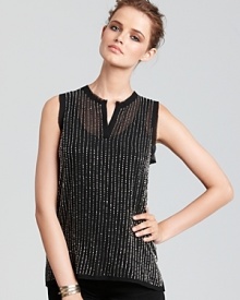 A wardrobe enhancement for fall, this Aqua henley gets dressed up with clear beading for a chic evening piece you can wear solo on layered beneath a tailored blazer. A wardrobe enhancement for fall, this Aqua henley gets dressed up with clear beading for a chic evening piece you can wear solo on layered beneath a tailored blazer.