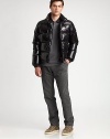 Beat the elements in high style in this sleek, down-filled bomber style, that ensures superior warmth and comfort, complete with a rich, lustrous finish.Zip frontSnap button placketStand collarSide zip pocketsFully linedAbout 26 from shoulder to hemNylonDry cleanImported