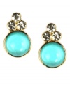 Simple studs shimmering with pretty accents. Anne Klein earrings feature bezel-set, plastic turquoise stones and crystal accents set in gold tone mixed metal. Approximate diameter: 1/2 inch.