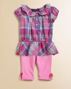 Sweet ruffles adorn a preppy madras tunic that is made complete with a matching legging for the perfect set.Ruffled Peter Pan collarShort puffed sleevesFront button placketRuffled hemElastic waistbandBow detail at hemTunic: CottonLeggings: 93% cotton/7% polyesterMachine washImported Please note: Number of buttons may vary depending on size ordered. 
