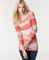 Win the style race with BCBGMAXAZRIA's long sleeve top, finished by a lace print-- it's a must-have look!